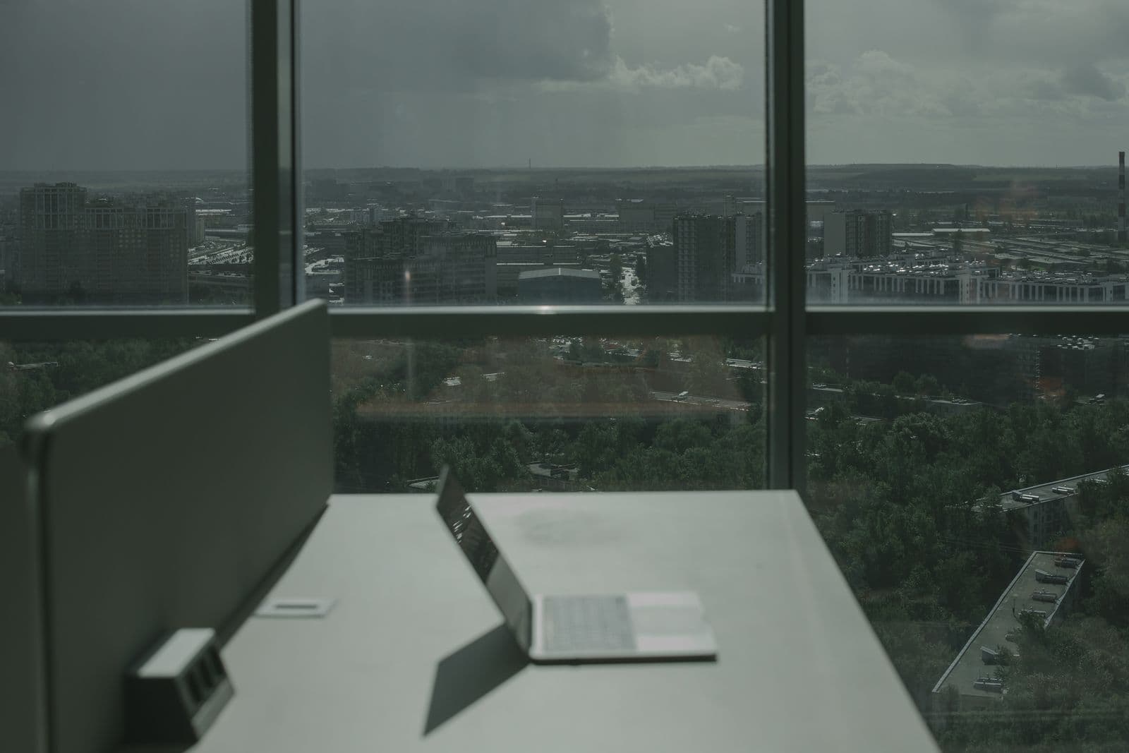 Laptop running a web application beside a window